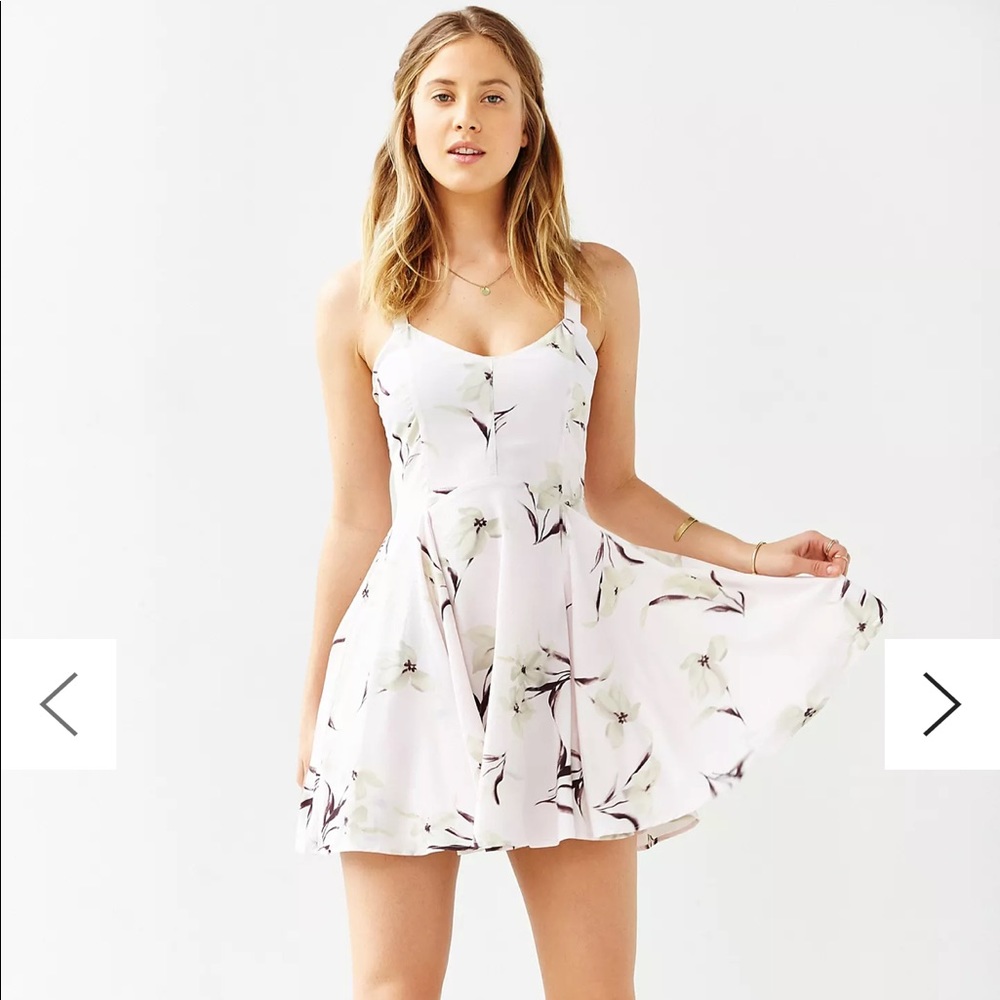 Pale pink Margot dress with flower design.